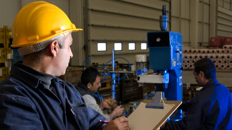 Man with a hard hat, inspecting things