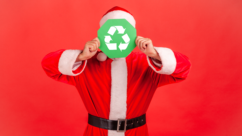 person as santa with recycle sign