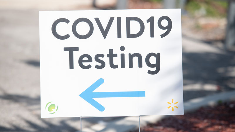sign that reads "COVID testing"