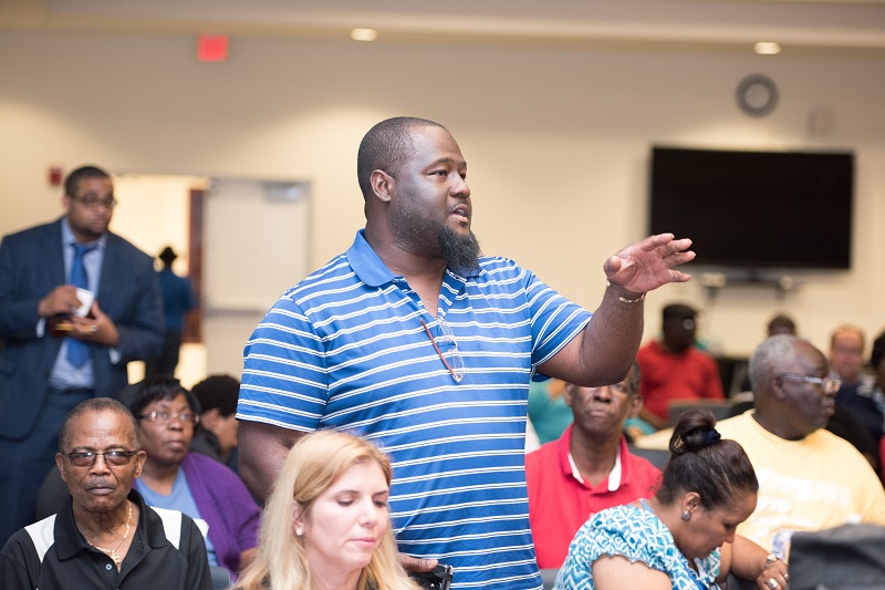 Person speaking at a meeting